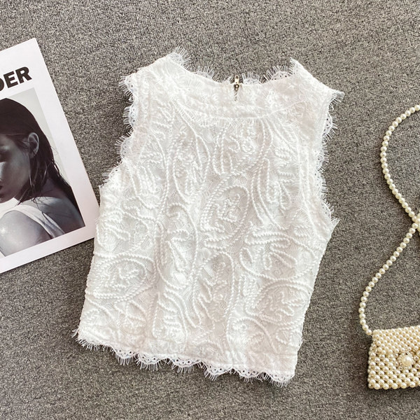 Modern női felső, hímzéssel és cipzárral a hátán