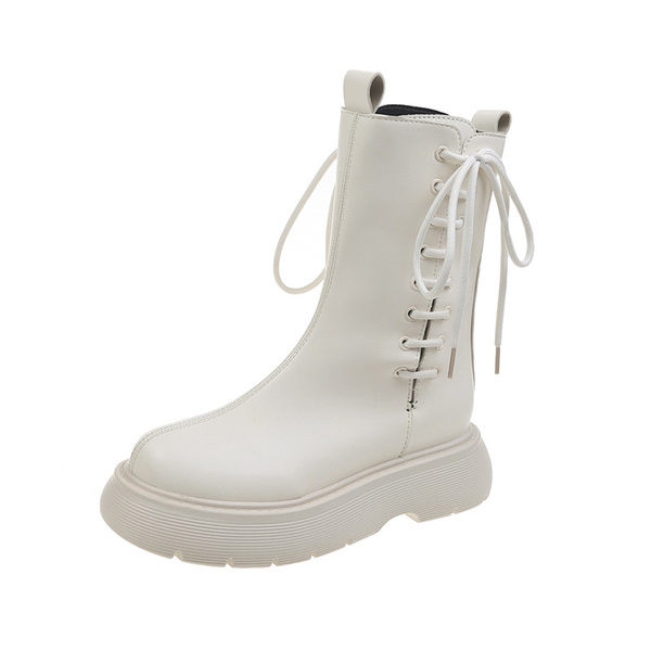 Kunstnahast naiste saapad küljesidemetega