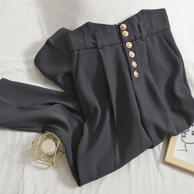 Modern női nadrág gombokkal, magas derékkal