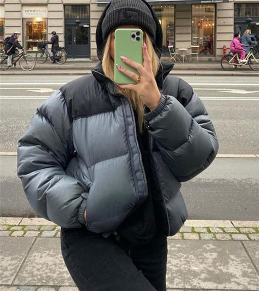 Moodne naiste lühike jope luku ja taskutega