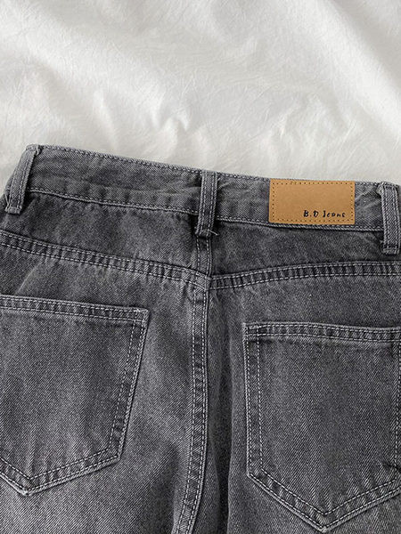 Széles farmer szakadt motívumokkal, magas derékkal