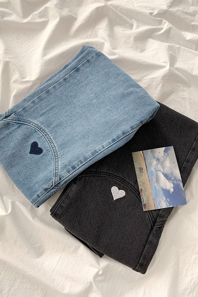 Naiste tikandiga teksapüksid kõrge vöökohaga mudeliga