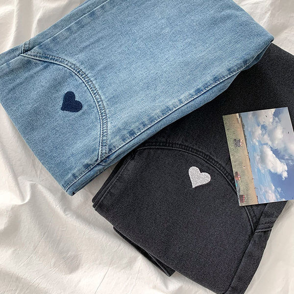 Naiste tikandiga teksapüksid kõrge vöökohaga mudeliga