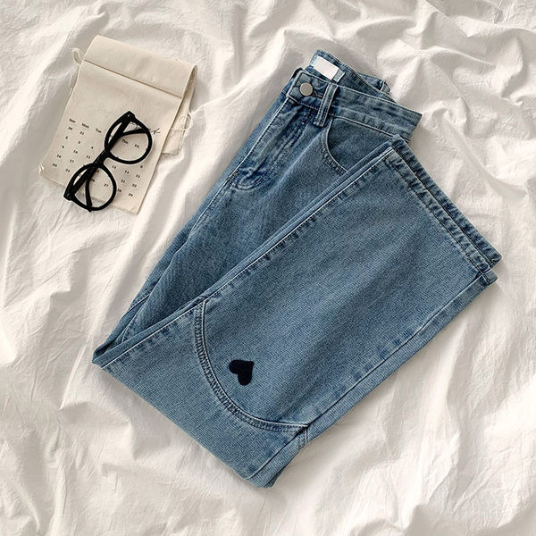 Naiste tikandiga teksapüksid kõrge vöökohaga mudeliga