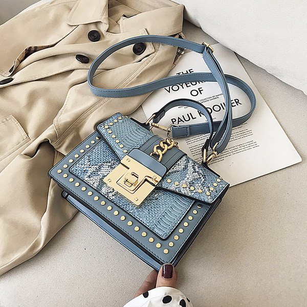 Geanta de dama moderna din piele ecologica cu nituri metalice si maner lung