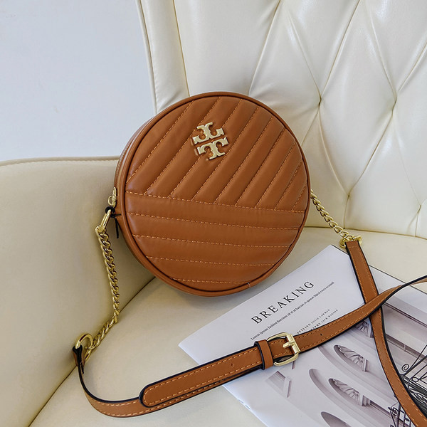 Geanta rotunda moderna cu element metalic si fermoar pentru femei