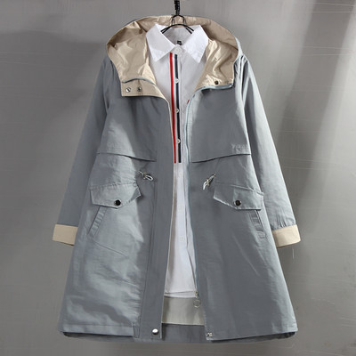 Φαρδύ γυναικείο μπουφάν με κουκούλα και τσέπες