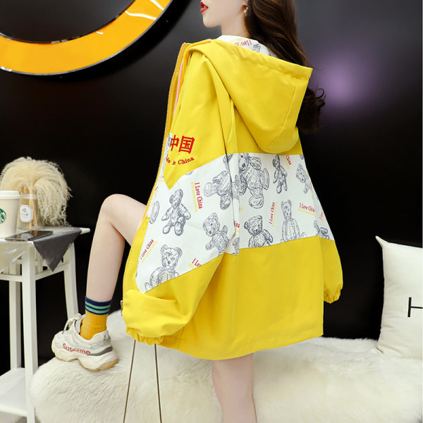 Široka ženska jakna s kapuljačom i vezicama