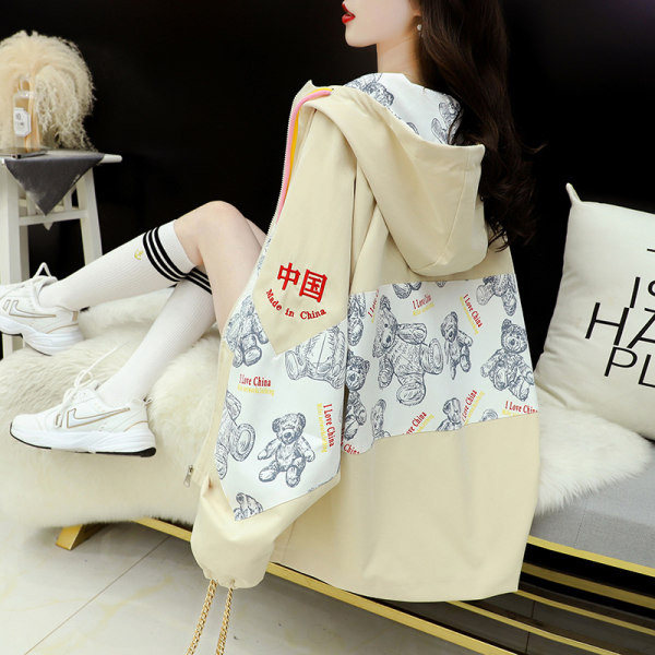 Široka ženska jakna s kapuljačom i vezicama