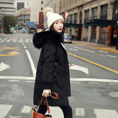 Γυναικείο μακρύ χειμερινό  μπουφάν με κουκούλα