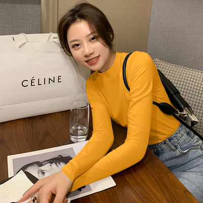 Μοντέρνα γυναικεία μπλούζα με ημι-ψηλό γιακά και κομμένα μέρη