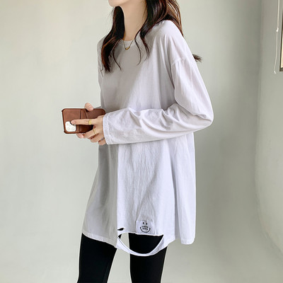 Γυναικεία φαρδιά μπλούζα με οβάλ λαιμόκοψη και σκισμένα μοτίβα