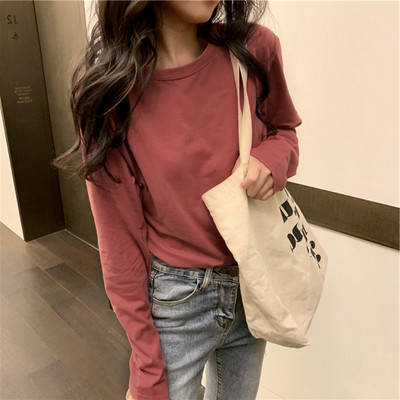 Široka ležerna bluza s okruglim izrezom u više boja