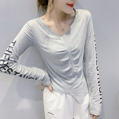 Asimetrična ženska bluza s dugim rukavima i špic izrezom