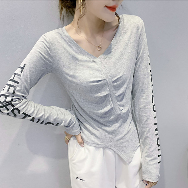 Asimetrična ženska bluza s dugim rukavima i špic izrezom