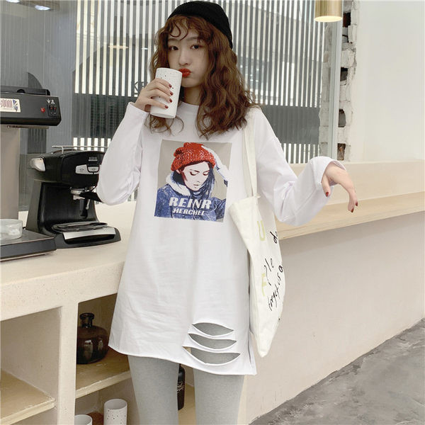 Široki model ženske bluze sa dugim rukavima, aplikacijom i rupama