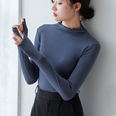 Ženska bluza s poluvisokom kragnom i kovrčama