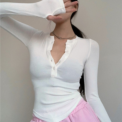 Γυναικεία εφαρμοστή μπλούζα με μακριά μανίκια και κουμπιά