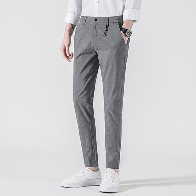 Sportsko-elegantne muške hlače s džepovima u sivoj i crnoj boji