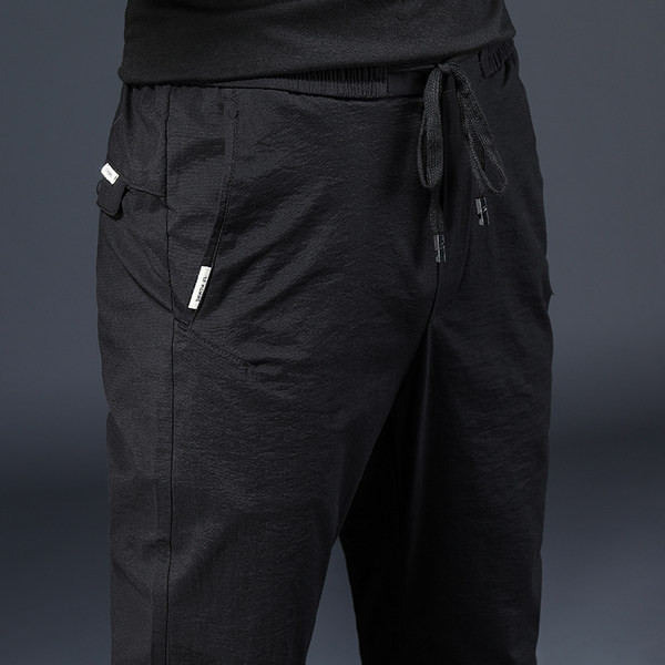 Vöökohal lipsudega õhukesed sportlikud vabaaja püksid