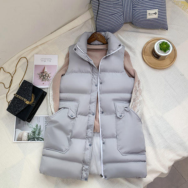 Vesta toamna-iarna cu lungime medie si buzunare mari