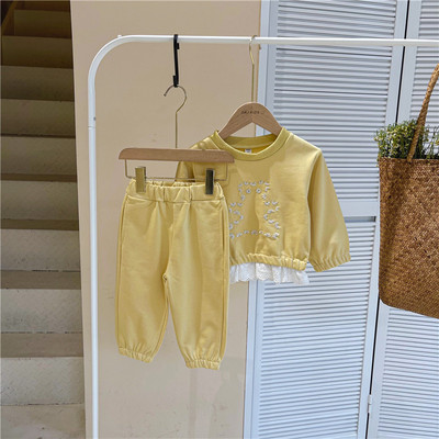 Set pentru copii din doua piese bluza cu broderie si pantaloni cu buzunare