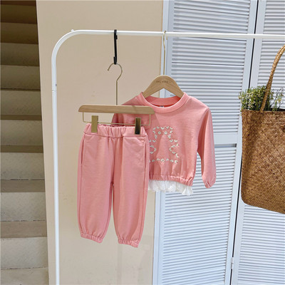 Set pentru copii din doua piese bluza cu broderie si pantaloni cu buzunare