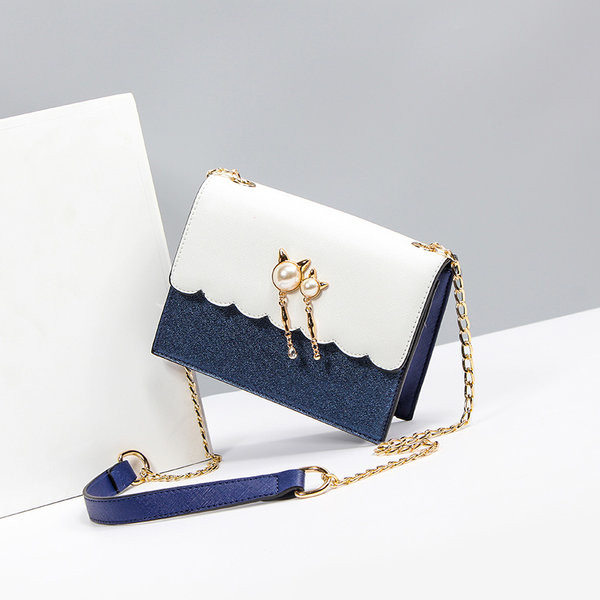 Moderna ženska torba sa metalnim lancem - u više boja