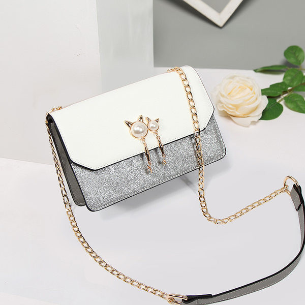 Moderna ženska torba sa metalnim lancem - u više boja