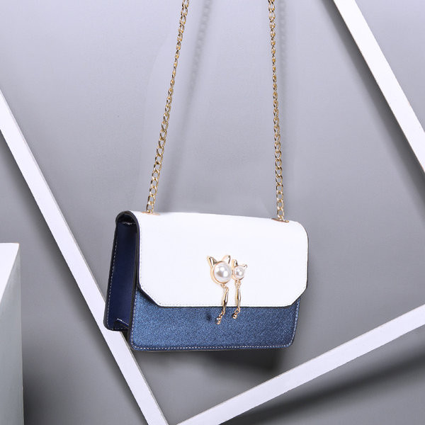 Moderna ženska torba sa metalnim lancem - u više boja