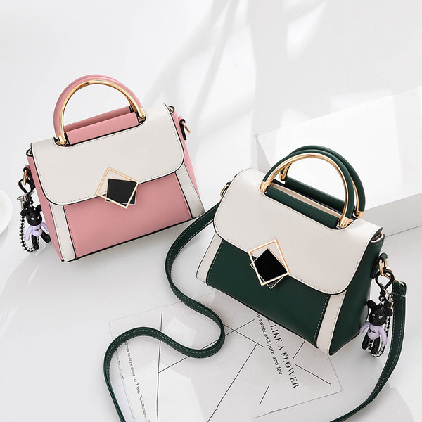 Ženska četvrtasta torba s kratkom i dugom ručkom i metalnim kopčanjem