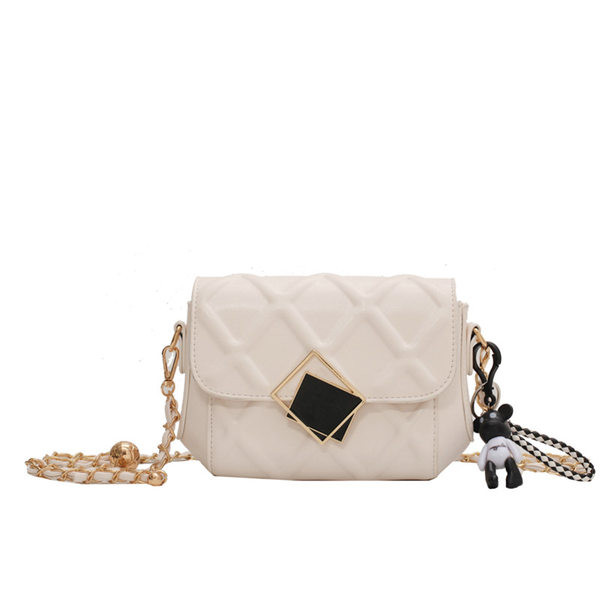 Prošivena ženska torba s metalnim kopčanjem i dugom ručkom