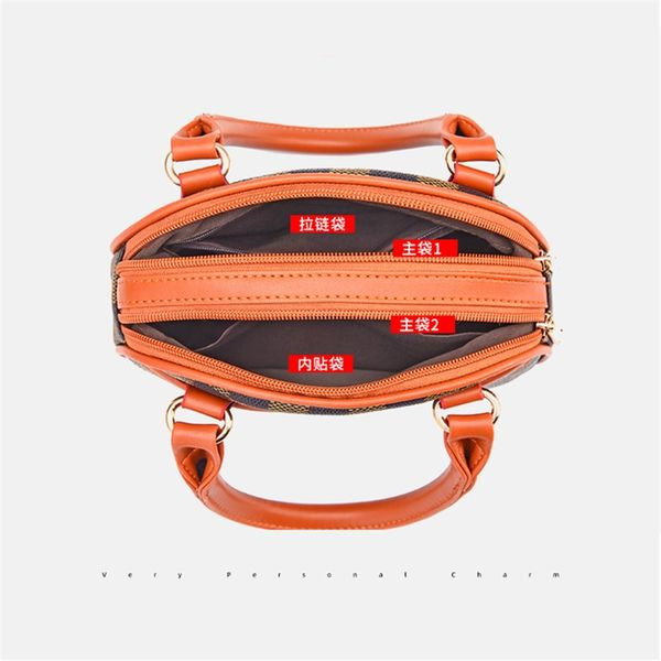 Дамска чанта с метален елемент и къса дръжка