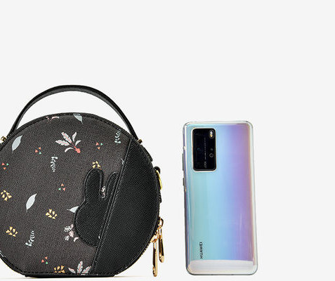 Дамска кръгла чанта от еко кожа с апликация 