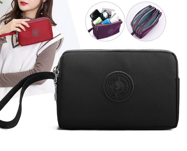 Mala torbica od tkanine sa patentnim zatvaračem i ručkom za ruku