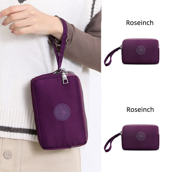 Mala torbica od tkanine sa patentnim zatvaračem i ručkom za ruku