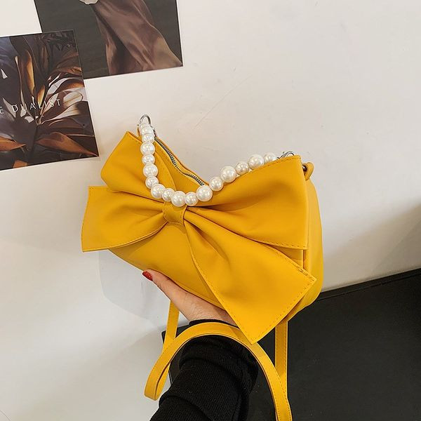 Стилна дамска чанта с панделка и декоративни перли