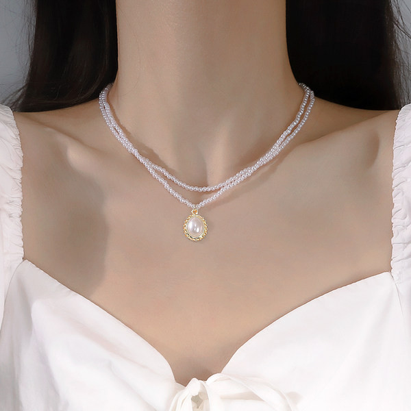 Κομψό γυναικείο κολιέ σε τρία μοντέλα με πέρλες