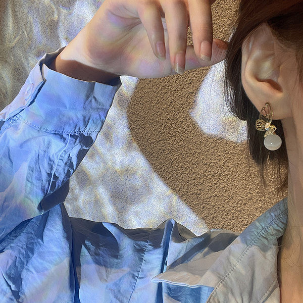 Γυναικεία σκουλαρίκια με πέρλα και πεταλούδα