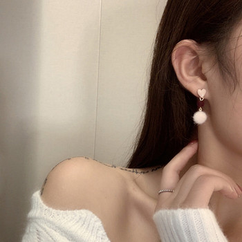 Κρεμαστά γυναικεία σκουλαρίκια με πούπουλα