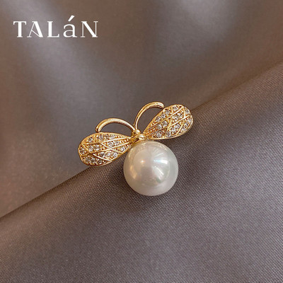 Moteriška sagė su akmenukais ir perlais