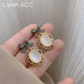 Viseće ženske naušnice s kamenčićem i vrpcom