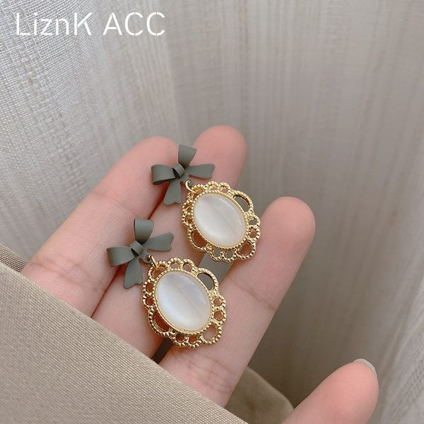 Viseće ženske naušnice s kamenčićem i vrpcom