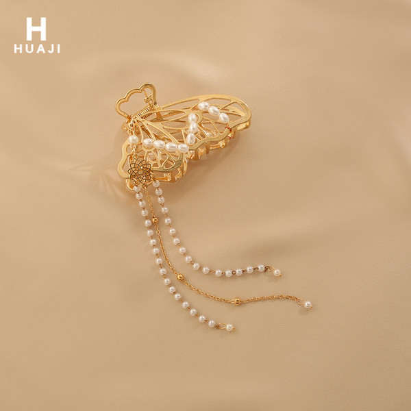 Ženska ukosnica sa bisernim ukrasom - zlatne boje