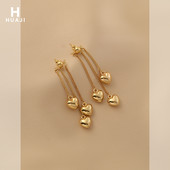 Μακριά γυναικεία σκουλαρίκια με μενταγιόν καρδιά