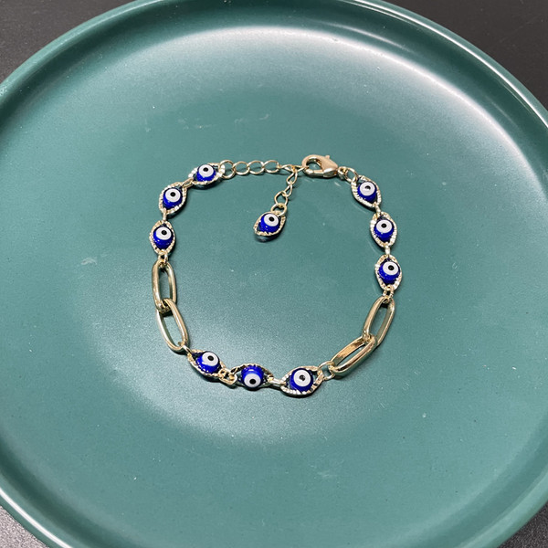 Γυναικείο βραχιόλι σε χρυσό χρώμα με μπλε μάτι