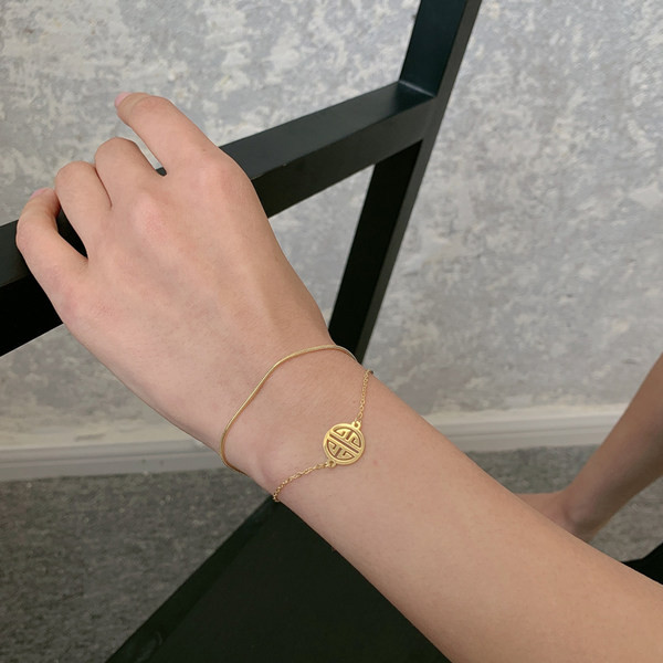 Γυναικείο διπλό βραχιόλι σε χρυσό χρώμα