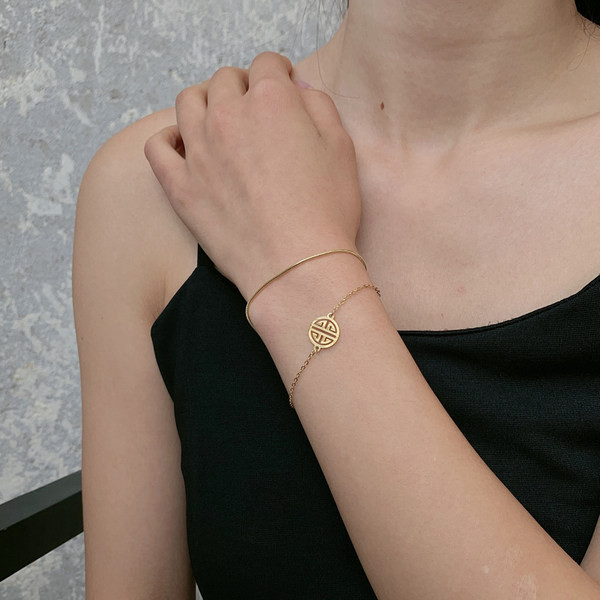 Γυναικείο διπλό βραχιόλι σε χρυσό χρώμα