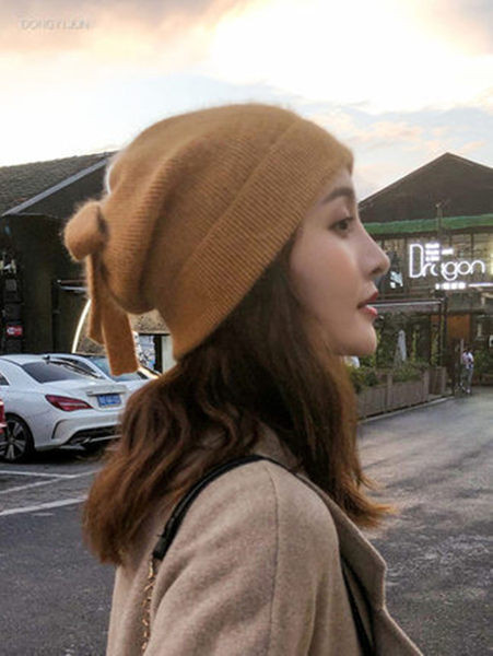 Ženska debela vunena kapa sa trakom