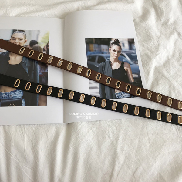 Perforált női öv fém díszítéssel